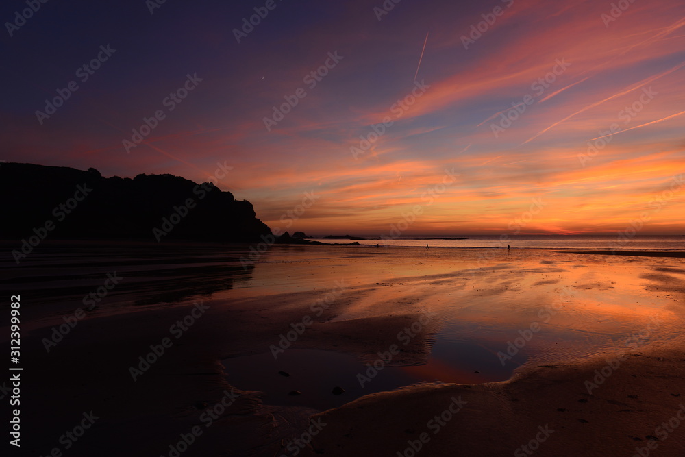 Ouasine Bay, Jersey, U.K. Winter coastal sunset.