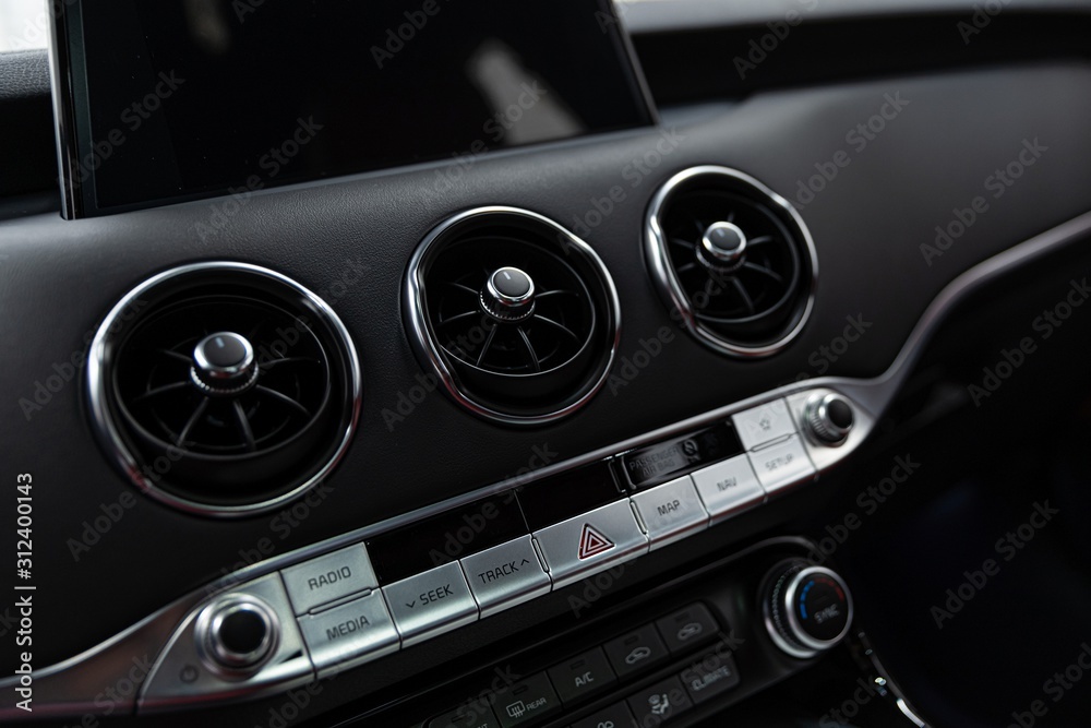 Car air vents and air conditioner control panel.