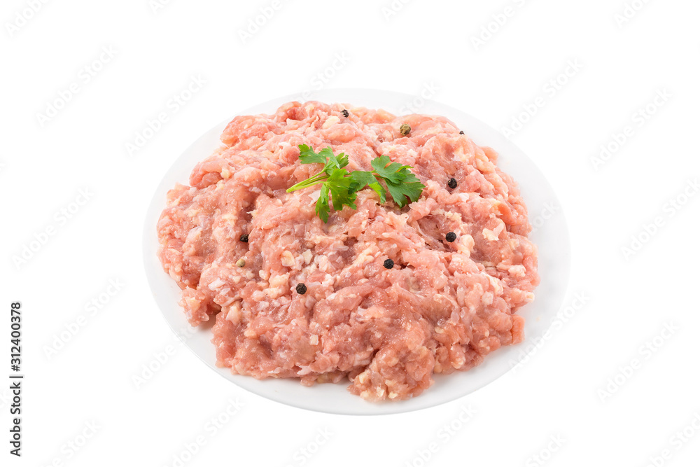 Raw chicken minced meat in a plate with herbs and spices isolated on white background Raw chicken minced meat in a plate with herbs and spices isolated on white background