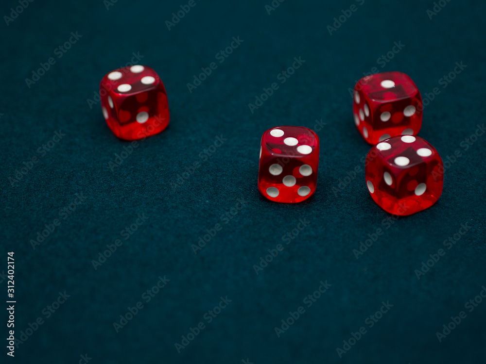 red Dices on green casino table red Dices on green casino table