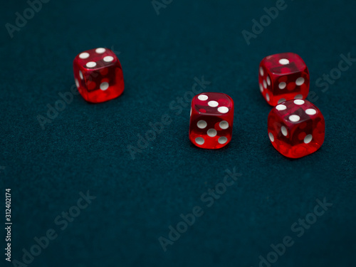 red Dices on green casino table