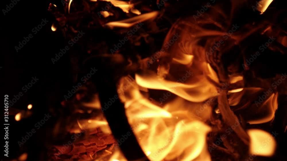 Close up fire flame texture. Burning wooden background