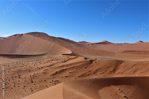 Beautiful scenic panorama view from big daddy also known as Dune 45 in Namib Naukluft Nationalpark, Sossusvlei, Namibia