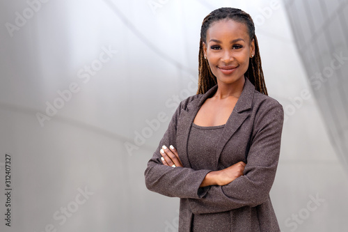 Beautiful female african american business woman CEO, legal, financial, attorney, confident with arms folded photo