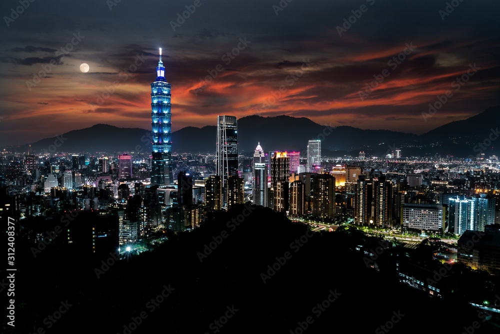 Obraz premium Beautiful city skyline in taipei taiwan after sunset, skyscraper buildings and light at night