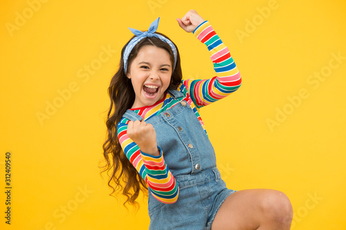 summer vacation joy. little child yellow background. old fashioned handkerchief for kid. beauty and fashion. small girl long hair. happy childhood. retro girl express happiness. feeling great success
