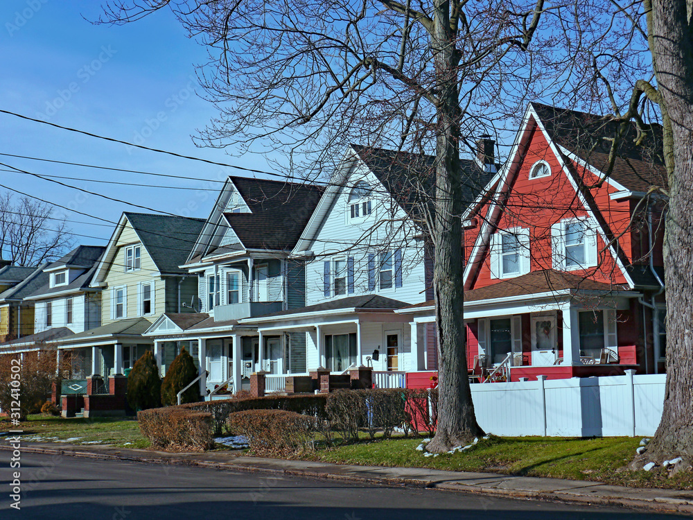 Street of older detached houses with gables