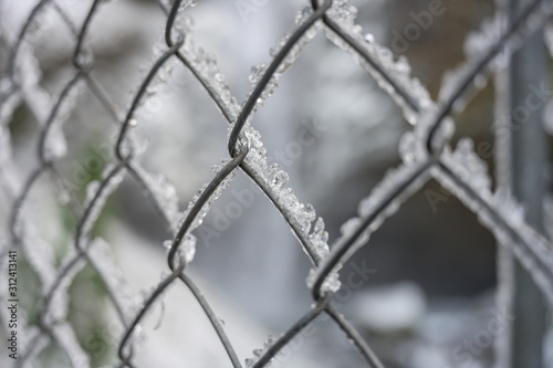 Angled View of Ice on Chain Link Fence