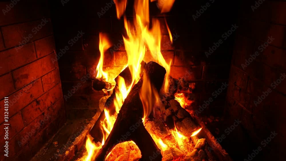 Video of cosy fireplace with reddish fire during Christmas holidays Video of cosy fireplace with reddish fire during Christmas holidays