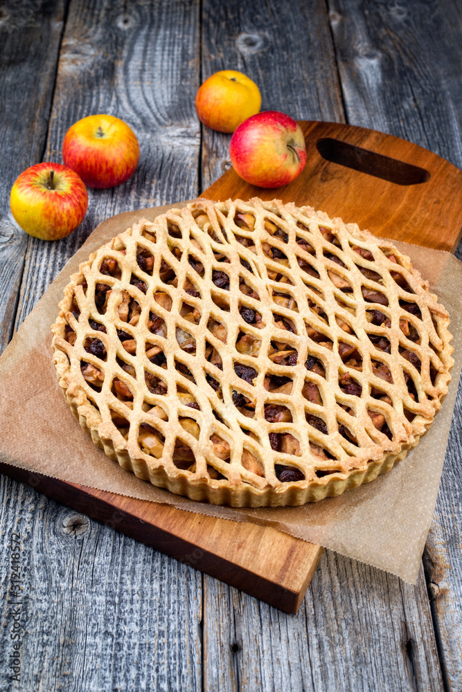 Traditional apple jalousie cake offered as closeup on a modern design wooden board Traditional apple jalousie cake offered as closeup on a modern design wooden board