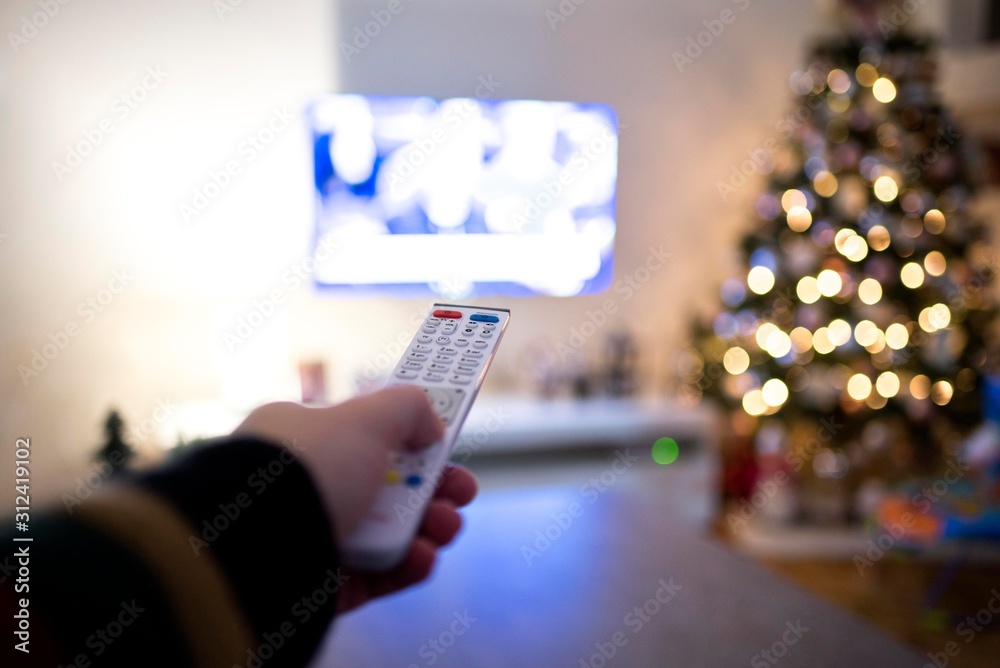 Male hand holding TV remote control. tv remote controller Male hand holding TV remote control. tv remote controller
