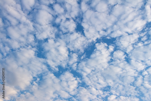 White clouds in the blue sky. Background. Texture