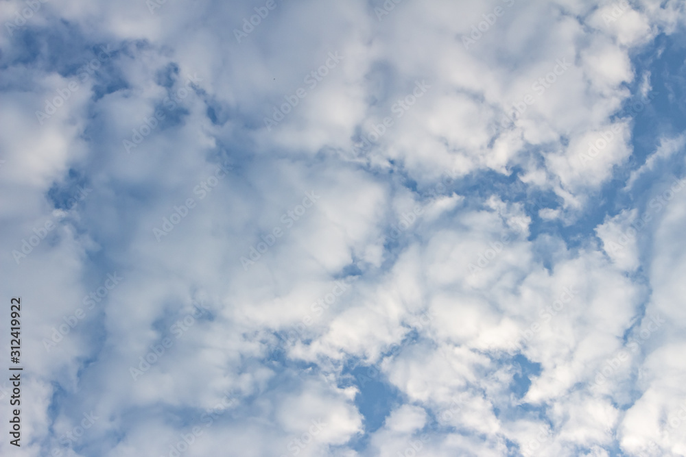 White clouds in the blue sky. Background. Texture