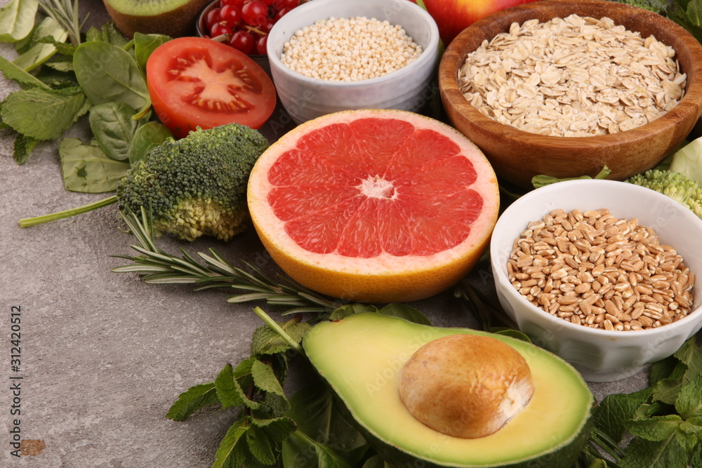 Healthy food clean eating selection: fruit, vegetable, seeds, superfood, cereals, leaf vegetable on rustic background Healthy food clean eating selection: fruit, vegetable, seeds, superfood, cereals, leaf vegetable on rustic background