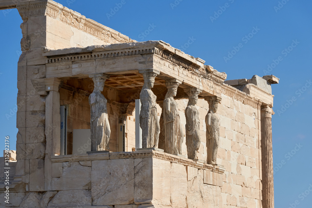 Obraz premium Erechtheion is an ancient Greek temple on the north side of the Acropolis of Athens in Greece which was dedicated to both Athena and Poseidon.