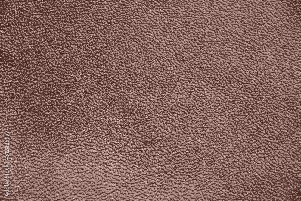 The texture of genuine leather. Impeccable and stylish background.  Beautiful stylish background. Natural skin texture close up. Brown  background. The structure of the leather material brown shades Stock Photo
