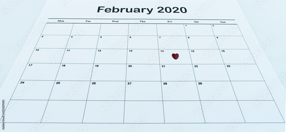 Calendar page with red heart on February 14 of Saint Valentines day. Happy Valentines Day concept. Calendar page with red heart on February 14 of Saint Valentines day. Happy Valentines Day concept.