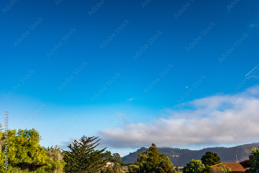 Obraz premium blue sky, moon, and clouds 