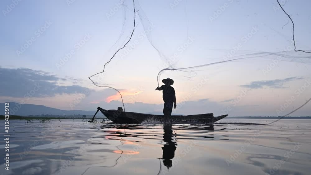 4K footage of fisherman throwing net into the lake