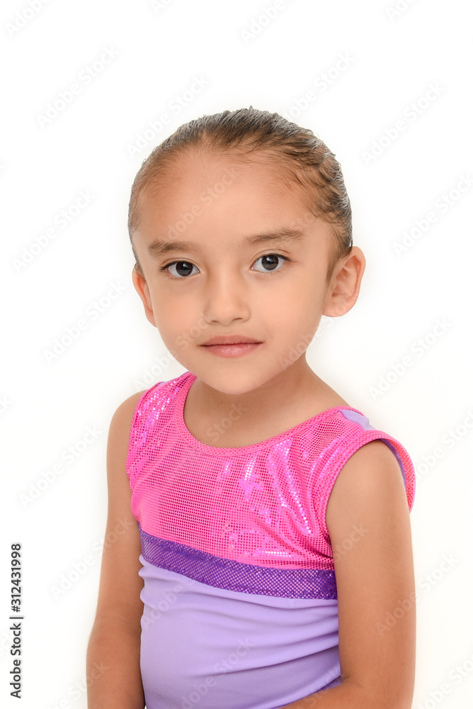 small latin girl doing gymnastics with white background and purple sportswear small latin girl doing gymnastics with white background and purple sportswear