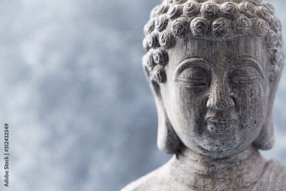 Obraz premium Meditating Buddha Statue on bright background. Copy space.