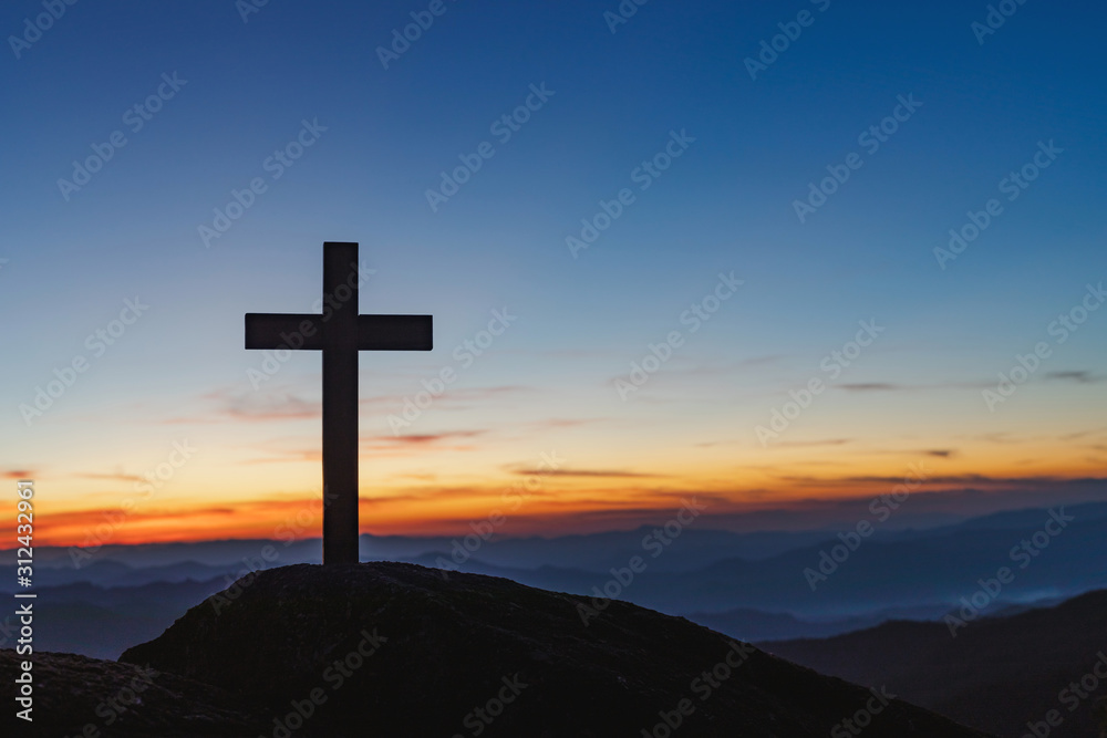 Silhouette cross on mountain at sunset background.Crucifixion Of Jesus Christ