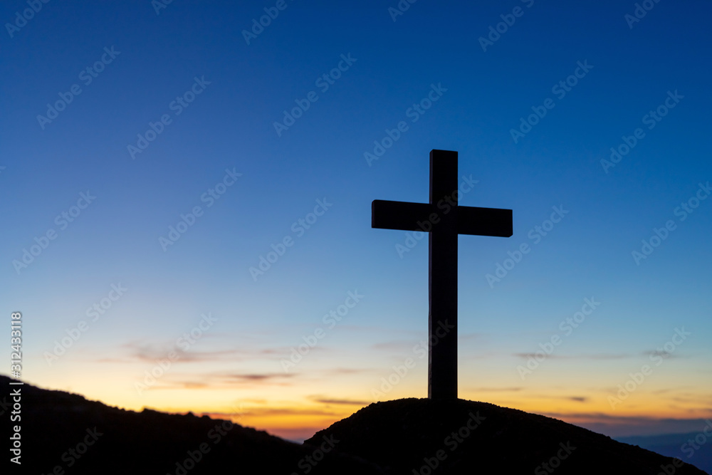 Silhouette cross on mountain at sunset background.Crucifixion Of Jesus Christ