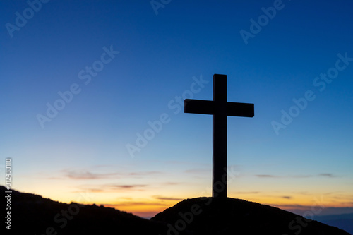 Silhouette cross on mountain at sunset background.Crucifixion Of Jesus Christ