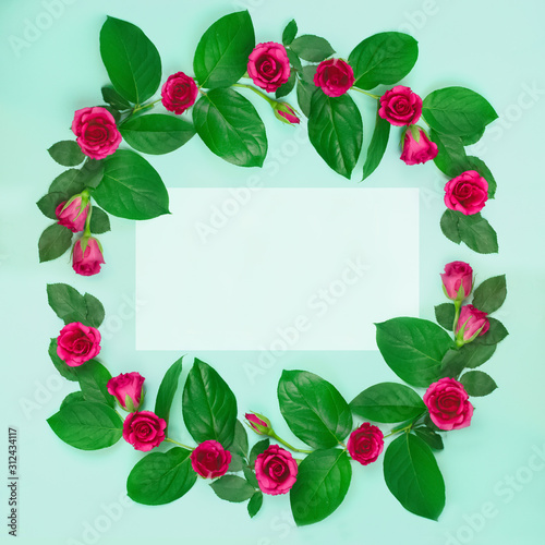 Wreath of roses with leaves and empty space inside on a blue background.Beautiful greeting card Valentine's day, Wedding, birthday, mother's day. sale