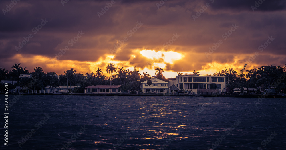 sunset florida miami water sun landscape palm trees houses lighting orange sky ocean