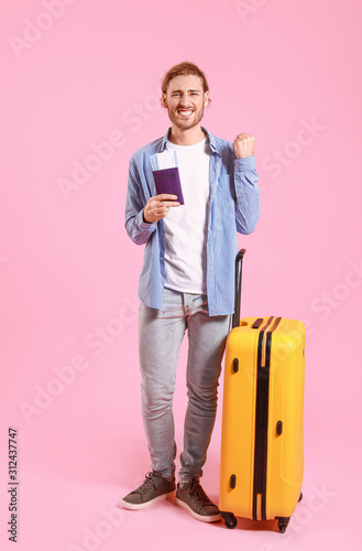 Young tourist with luggage ...