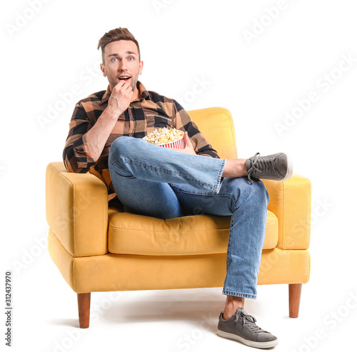 Handsome man watching movie...