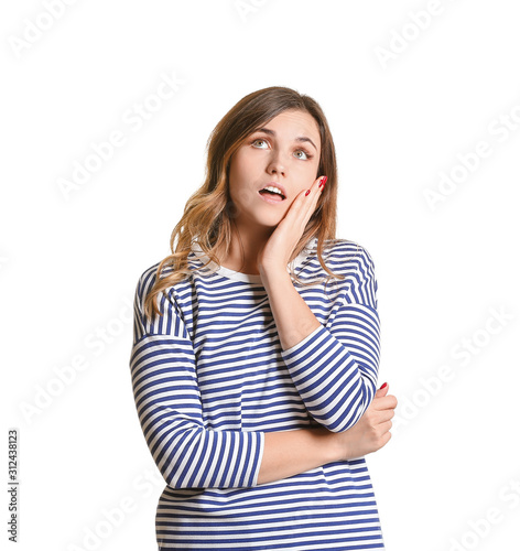 Thoughtful young woman on w...