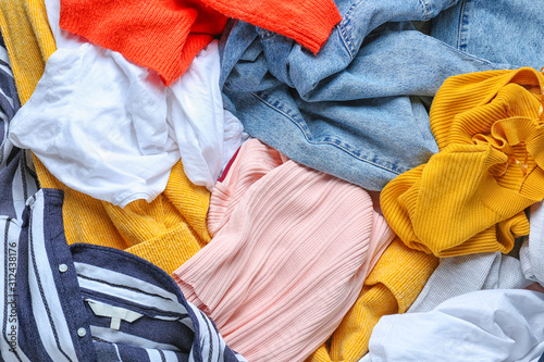 Heap of different clothes, top view
