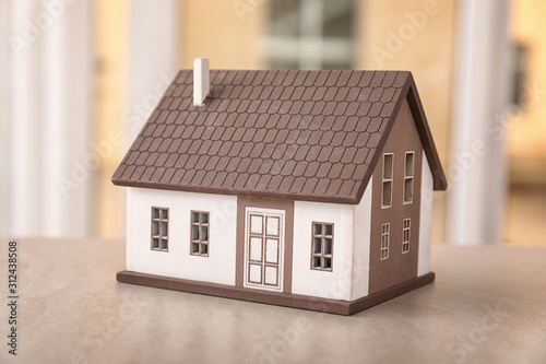 Model of house on table indoors