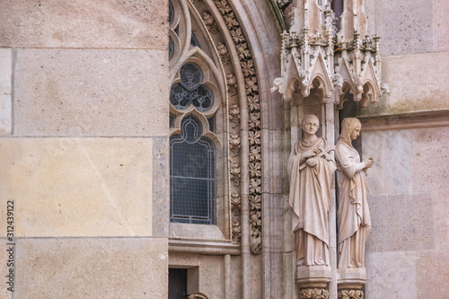 Photography City landscape - view of the sculptures of the neo-Gothic church Votivkirche (Vo