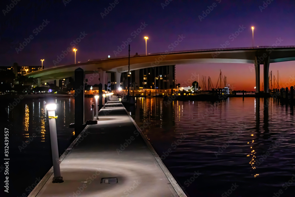 View of a harbor and bridge as the sun sets in Clearwater, Florida