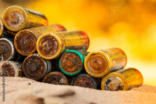 Old battery leak isolated / Hazardous waste concept/The battery is worn out.