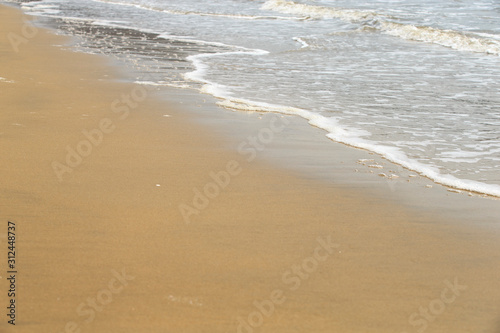 Golden sandy beach. Golden sandy beach with calm waves.