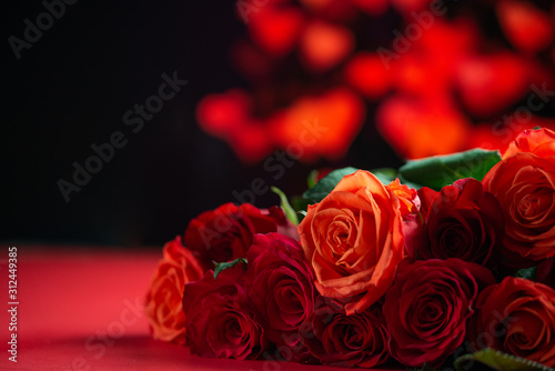 Romantic red roses on a red background with hearts  Valentine s day  love and romance  wedding background