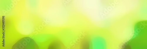 blurred iridescent horizontal background texture with khaki, pale golden rod and moderate green colors and space for text or image