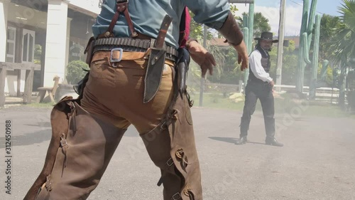 A sherriff ready to gun draw with the culprit infront of sheriff office.