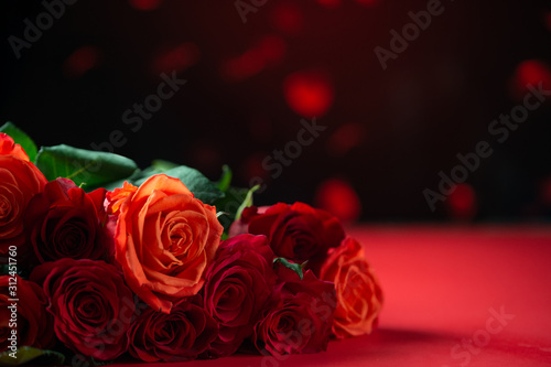 Romantic red roses on a red background with hearts  Valentine s day  love and romance  wedding background