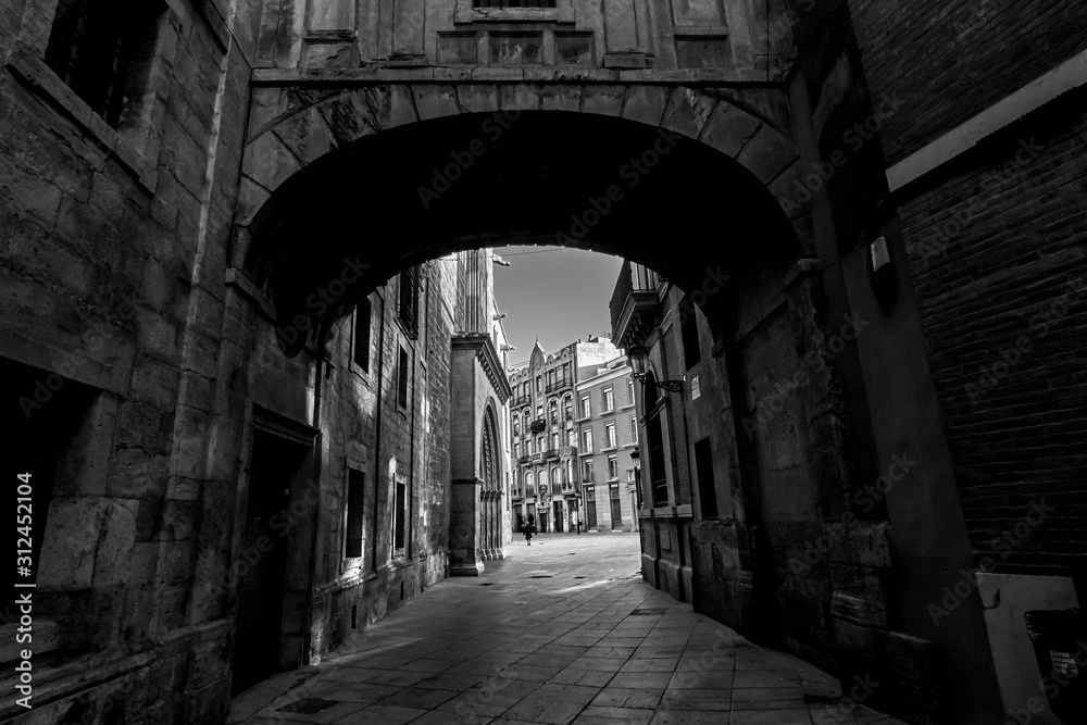 Valencia Spain Narrow Street with Arch Bridge Black and White Photography