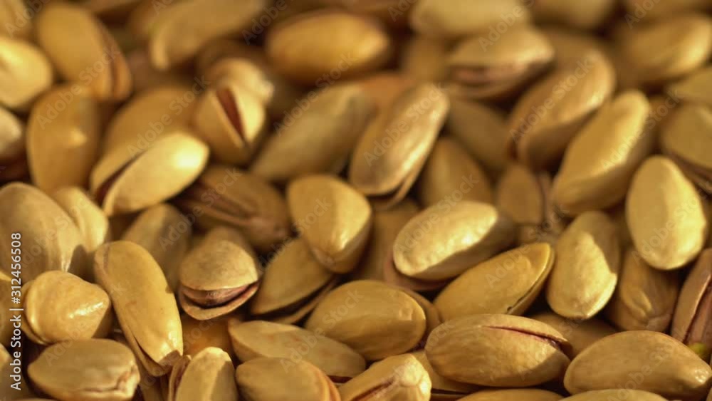 Roasted pistachios close-up. Pistachio nut with salt. macro Roasted pistachios close-up. Pistachio nut with salt. macro