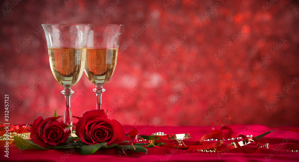 Champagne glass and roses on velvet drape Champagne glass and roses on velvet drape