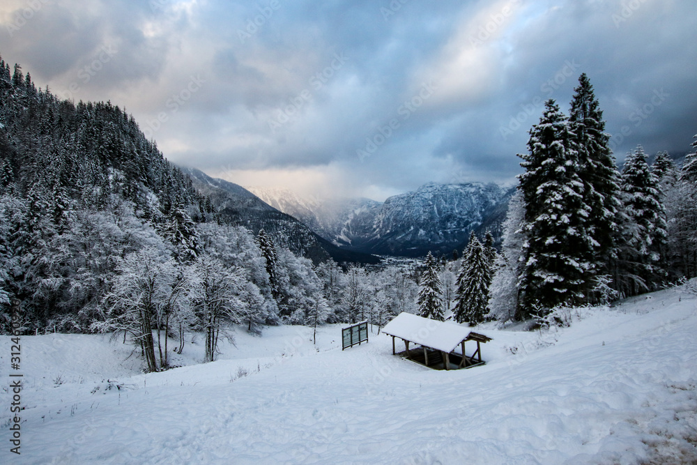 Beautiful Winter View of Hallstatt Austria with dramatic sky and clouds
