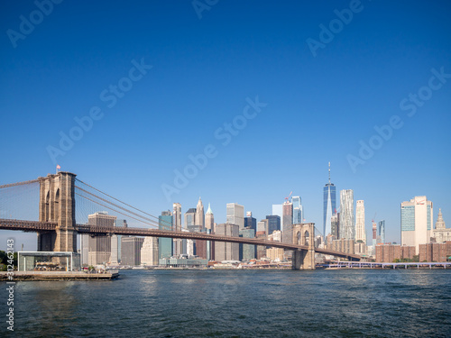 Fototapeta Naklejka Na Ścianę i Meble -  Brooklyn bridge, New York, USA - September 2019: [ Brooklyn bridge architecture with panoramic view of New York City and lower Manhattan, One World Trade Center, Dumbo ]