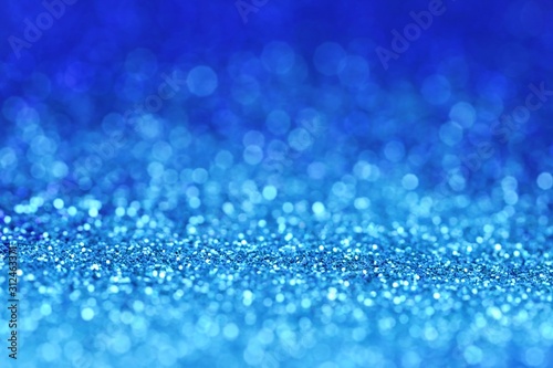 blue glitter shiny background.panton 2020 classic blue.glitter blue gradient texture with bokeh. classic blue swatch for print, web design.New year wallpapers phone