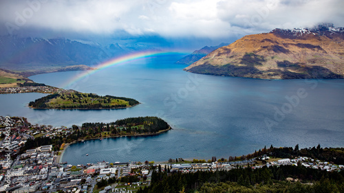 Queenstown, New Zealand - A rainbow appears over Queenstown after a lunchtime rain shower. This view is from the observatory at the top of Skyline gondola